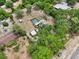 The aerial view captures the home, fenced in pool and surrounding land at 31544 Wekiva River Trl, Sorrento, FL 32776