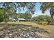 Exterior image of home, pool and shed, complimented with established shade trees at 31544 Wekiva River Trl, Sorrento, FL 32776