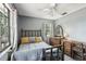 Bedroom with gray walls, carpet, ceiling fan and large, bright windows at 31544 Wekiva River Trl, Sorrento, FL 32776