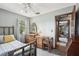 This bedroom features a ceiling fan, a window and a nice wood furniture set at 31544 Wekiva River Trl, Sorrento, FL 32776