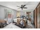 Bedroom with gray walls, carpet, ceiling fan, and updated window at 31544 Wekiva River Trl, Sorrento, FL 32776