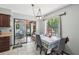 Dining room area with chandelier and a window with backyard view at 31544 Wekiva River Trl, Sorrento, FL 32776