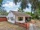 Charming one-story home with neutral paint, a screened-in porch, and landscaped yard at 31544 Wekiva River Trl, Sorrento, FL 32776