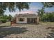 Charming one-story home with neutral paint, a screened-in porch, and landscaped yard at 31544 Wekiva River Trl, Sorrento, FL 32776