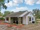 Charming one-story home with neutral paint, a screened-in porch, and landscaped yard at 31544 Wekiva River Trl, Sorrento, FL 32776