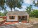 Charming one-story home with neutral paint, a screened-in porch, and landscaped yard at 31544 Wekiva River Trl, Sorrento, FL 32776