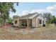 View of the side of the home, showing the screened porch, siding, and fenced yard at 31544 Wekiva River Trl, Sorrento, FL 32776