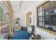 The porch has carpeted floors, a window and a chair at 31544 Wekiva River Trl, Sorrento, FL 32776