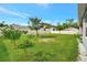 Spacious backyard with lush green lawn and a pristine white fence at 316 Nowell Loop, Deland, FL 32724