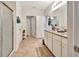 Bright bathroom with tile floor, granite counters, double sinks, and a glass enclosed shower at 316 Nowell Loop, Deland, FL 32724