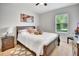 Bedroom featuring a comfortable bed, nightstand, and natural light from the window at 316 Nowell Loop, Deland, FL 32724
