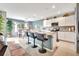 Bright kitchen with granite countertops and an island with bar seating at 316 Nowell Loop, Deland, FL 32724