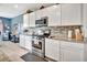 Well-equipped kitchen with stainless steel appliances and ample counter space at 316 Nowell Loop, Deland, FL 32724
