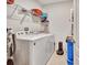 Laundry room featuring a washer, dryer, and shelving, offering convenience and organization at 316 Nowell Loop, Deland, FL 32724