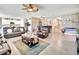 Open-concept living area with tile flooring and unique stone accent wall at 316 Nowell Loop, Deland, FL 32724