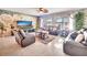 Cozy living room with a large screen TV and comfortable seating at 316 Nowell Loop, Deland, FL 32724