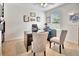 A home office with a black desk and two plush chairs, perfect for productivity and comfort at 316 Nowell Loop, Deland, FL 32724