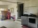 Laundry Room with modern washer and dryer, adjacent to an enclosed doorway at 317 Inwood Ave, New Smyrna Beach, FL 32168