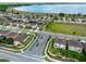 Aerial view of a neighborhood featuring landscaped streets and waterfront view in a beautiful community at 343 Lazio Cir, Debary, FL 32713