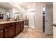 Bathroom featuring granite countertops, modern fixtures, and glass-enclosed shower at 343 Lazio Cir, Debary, FL 32713