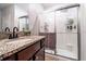 Bathroom featuring granite countertops and a glass-enclosed shower at 343 Lazio Cir, Debary, FL 32713