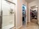 Modern bathroom featuring a shower and access to the walk-in closet at 343 Lazio Cir, Debary, FL 32713