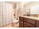 Well-lit bathroom with a shower and bath featuring a granite vanity at 343 Lazio Cir, Debary, FL 32713
