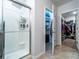 A bathroom features a glass shower with a rainfall shower head and modern fixtures at 343 Lazio Cir, Debary, FL 32713