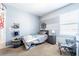 This bedroom features a gray accent wall, a twin bed, side table, and natural light at 343 Lazio Cir, Debary, FL 32713