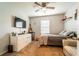 Bedroom with neutral walls, carpet, ceiling fan, and furniture at 343 Lazio Cir, Debary, FL 32713