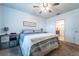 Comfortable bedroom featuring carpeted floors, ceiling fan, and neutral tones at 343 Lazio Cir, Debary, FL 32713