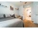 Bright bedroom featuring neutral paint, plush carpet, and comfortable seating area at 343 Lazio Cir, Debary, FL 32713