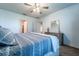 Relaxing bedroom with carpeted floors, ceiling fan, and neutral decor at 343 Lazio Cir, Debary, FL 32713