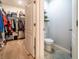 Well-organized walk-in closet next to the toilet, featuring shelving and hanging space at 343 Lazio Cir, Debary, FL 32713