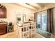 Cozy dining area with modern lighting, sliding glass doors to outdoor space, and decorative accents at 343 Lazio Cir, Debary, FL 32713