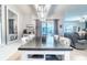Bright dining room with large table and sliding glass doors to the outdoor area at 343 Lazio Cir, Debary, FL 32713