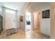 Inviting entryway with light tile flooring, neutral walls, and decorative farmhouse accents at 343 Lazio Cir, Debary, FL 32713