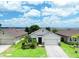 Charming single-story home featuring a well-manicured lawn, brick driveway, and attached two-car garage at 343 Lazio Cir, Debary, FL 32713