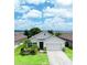 Beautiful one-story home featuring a well-maintained lawn, complemented by decorative landscaping and a neutral color scheme at 343 Lazio Cir, Debary, FL 32713