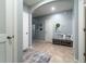 Hallway with gray accents, decor, tile flooring, and access to other rooms at 343 Lazio Cir, Debary, FL 32713