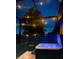 Inviting backyard featuring a relaxing hot tub and ambient string lights for evening enjoyment at 343 Lazio Cir, Debary, FL 32713
