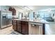Modern kitchen with stainless steel appliances, granite countertops, dark wood cabinets, and open-concept design at 343 Lazio Cir, Debary, FL 32713