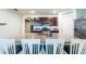 Kitchen featuring granite countertops, a kitchen island with seating, and modern appliances at 343 Lazio Cir, Debary, FL 32713