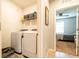 Laundry room with modern washer and dryer, and storage shelves at 343 Lazio Cir, Debary, FL 32713