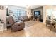 Comfortable living room featuring neutral tones, tile flooring, and lots of natural light at 343 Lazio Cir, Debary, FL 32713