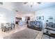 Open-concept living room with tile floors, comfortable seating, and access to the kitchen at 343 Lazio Cir, Debary, FL 32713
