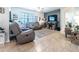 Comfortable living room with large tile floors, ceiling fan, and stylish decor at 343 Lazio Cir, Debary, FL 32713