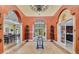 The community clubhouse lobby features elegant decor, a chandelier, and tile flooring at 343 Lazio Cir, Debary, FL 32713