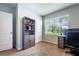 An office features a window, storage cabinet, desk, and neutral walls at 343 Lazio Cir, Debary, FL 32713