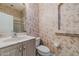 Small bathroom with sink, toilet, vanity, and standing shower at 3601 Galway Ln, Ormond Beach, FL 32174